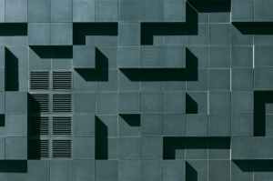 gray concrete building exterior with geometric design